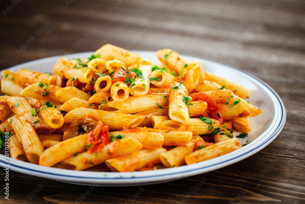 Penne with meat, tomato sauce and vegetables Penne with meat, tomato sauce and vegetables