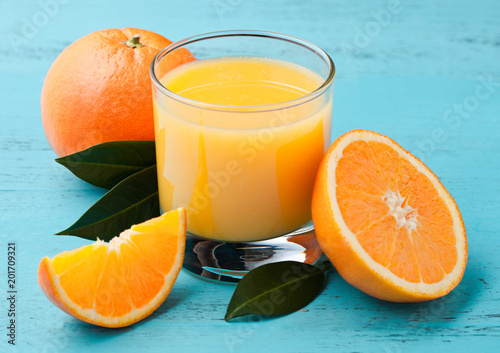 Glass of organic fresh orange juice with fruits