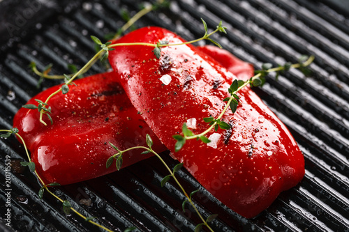 grilled red bell peppers with spices and herbs. Closeup. Copyspace