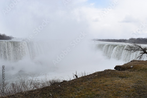 Beautiful gigantic frozen Horseshoe Niagara Waterfalls on a frozen spring day in Niagara Falls in Ontario  Canada