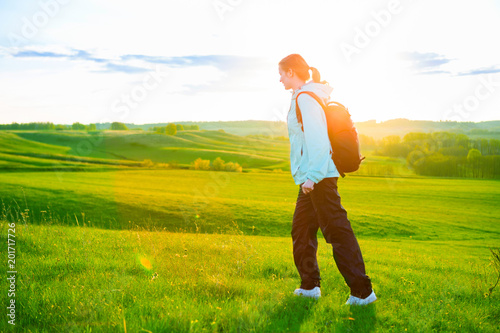 Young woman hiking in beautiful nature. Sports and healthy lifestyle concept photo