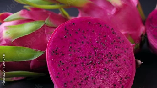 Dragon Fruit on dark background. Trucking shot. 4K resolution.