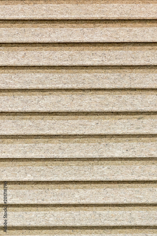 Closed blinds made of cork. background of a crooked tree in the form of blinds