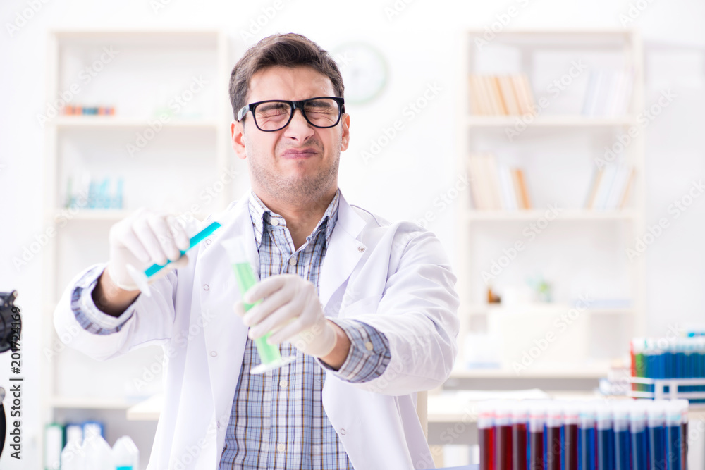 Chemistry student doing chemical experiments at classroom activi Chemistry student doing chemical experiments at classroom activi