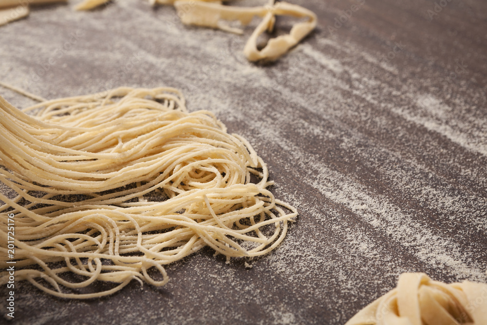 Fresh homemade Italian pasta on wooden table Fresh homemade Italian pasta on wooden table