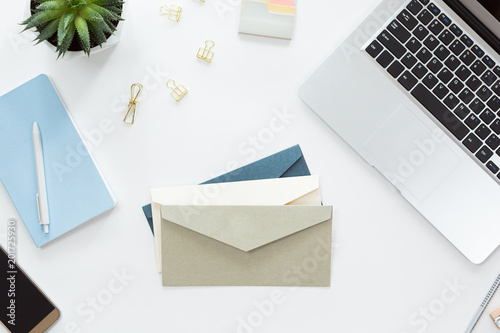 Konstfotografi Top view of woman hands opening envelope on white office table desk, flat lay