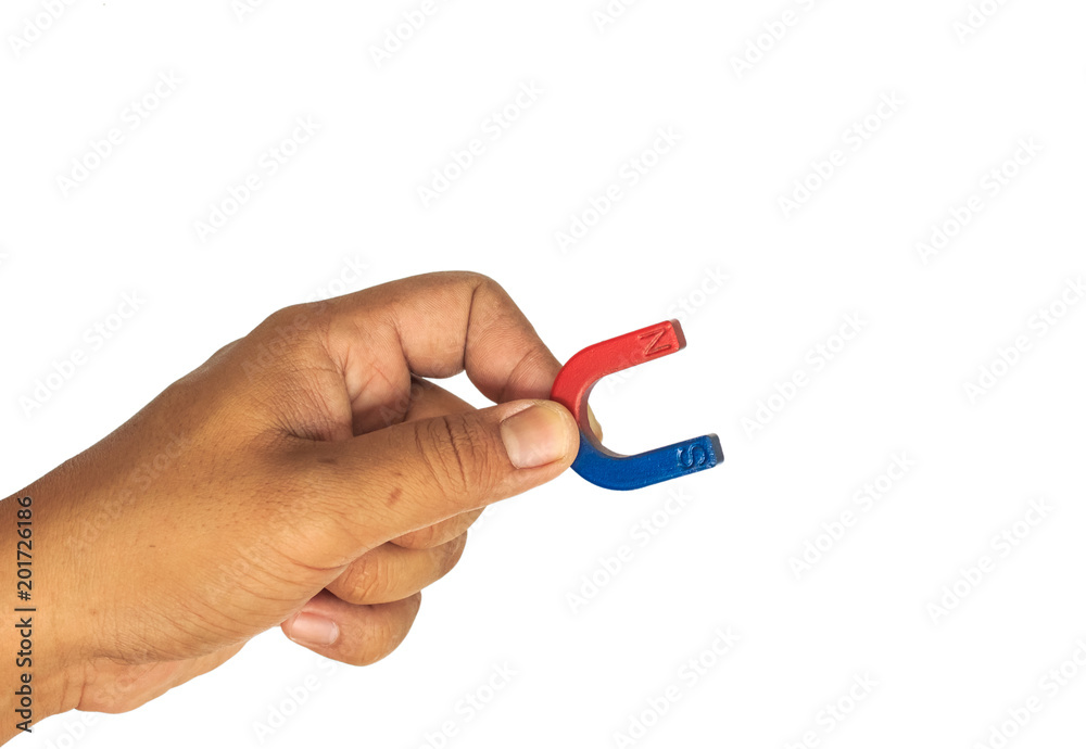 hand hold magnet on white background. hand hold magnet on white background.