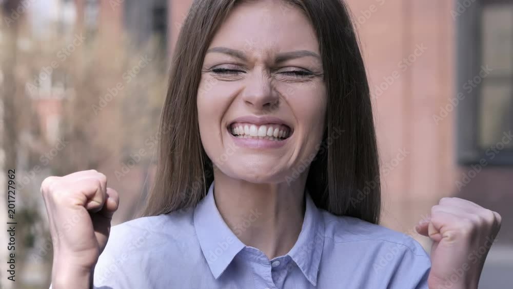 Excited Woman Reacting to Success, Staning Outside Office Excited Woman Reacting to Success, Staning Outside Office