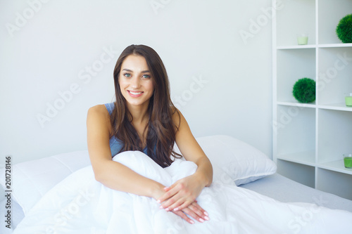 Young beauty asleep in a white bed