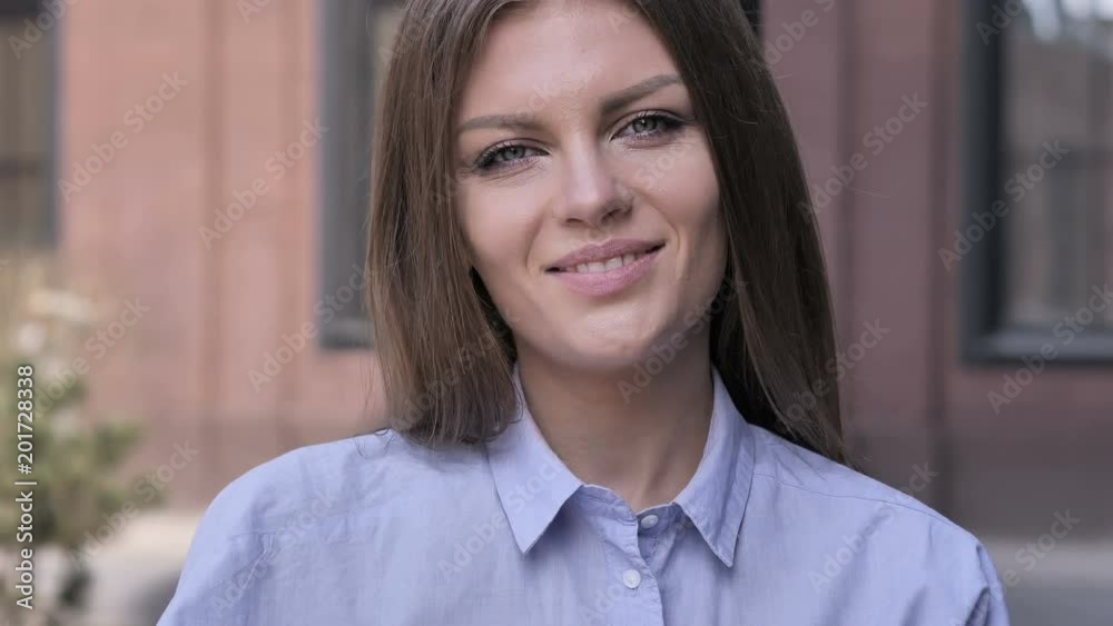 Portrait of Winking Smiling Woman Looking at Camera Portrait of Winking Smiling Woman Looking at Camera