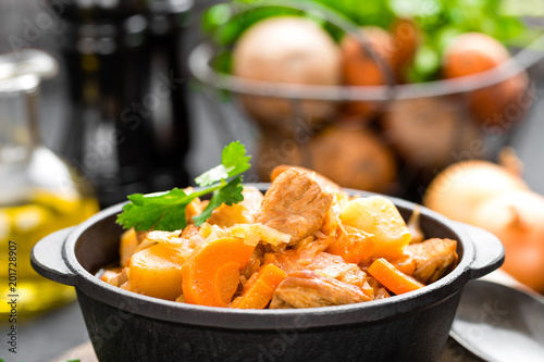 Meat stew with vegetables. Braised meat with cabbage, carrot and potato photo