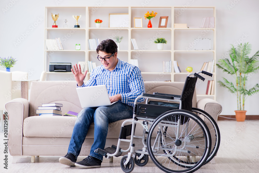 Young student on wheelchair in disability concept Young student on wheelchair in disability concept