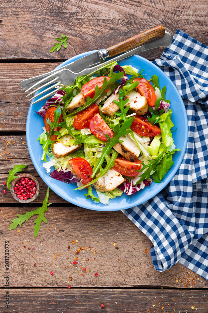 Vegetable salad with chicken meat. Salad with fresh vegetables and grilled chicken fillet Vegetable salad with chicken meat. Salad with fresh vegetables and grilled chicken fillet