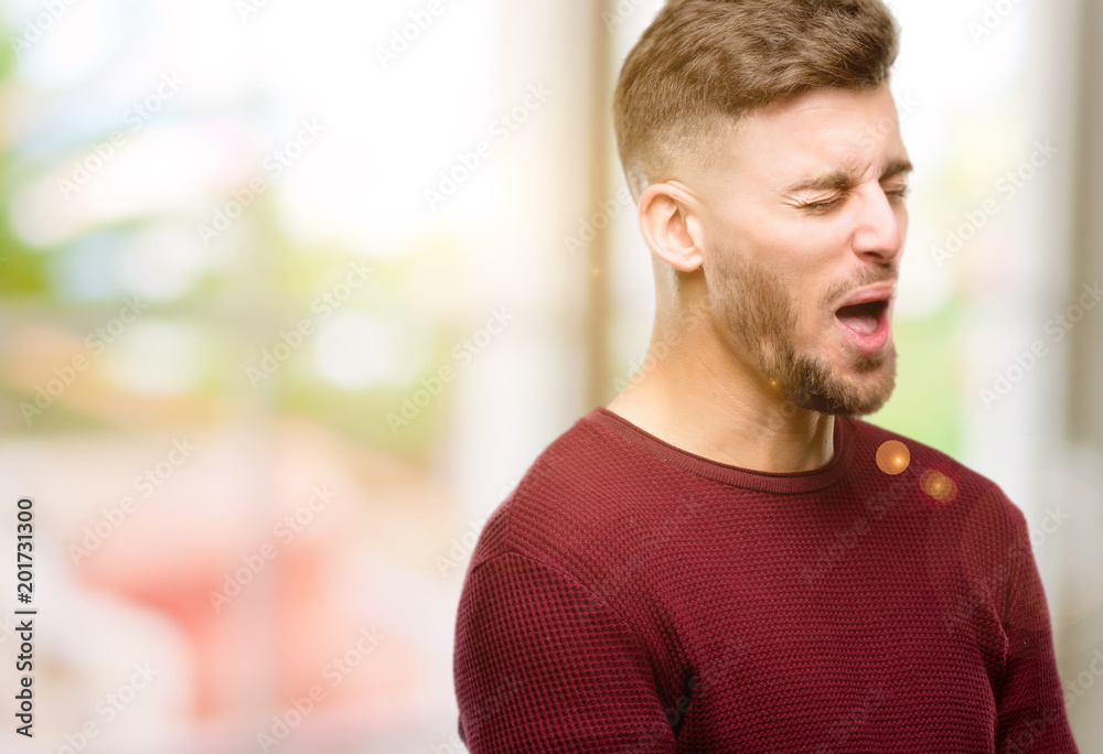 Handsome young man crying depressed full of sadness expressing sad emotion Handsome young man crying depressed full of sadness expressing sad emotion