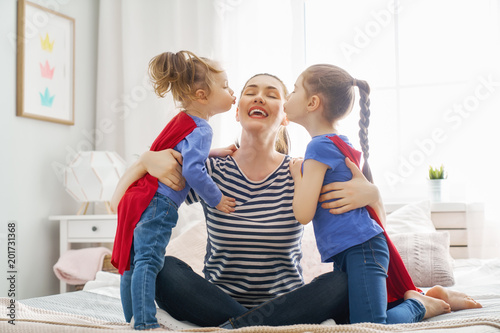 mother and daughters playing