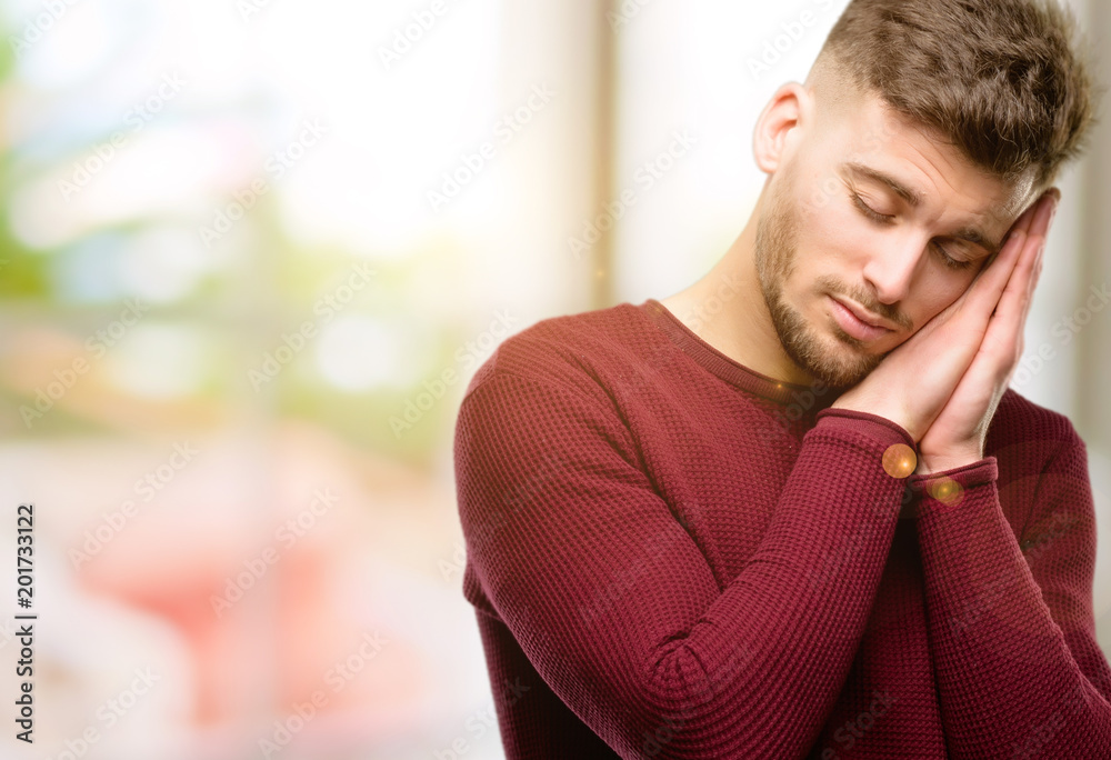 Handsome young man tired and bored, tired because of a long day overworking