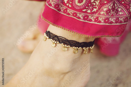 Female ankle with gypsy bracelet