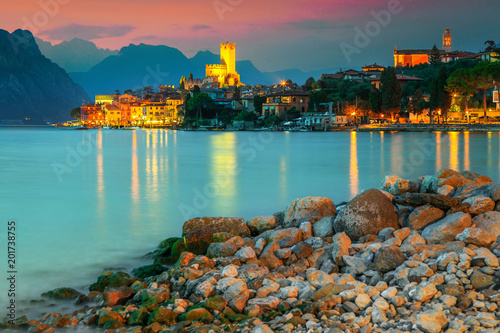 Amazing Malcesine tourist resort and colorful sunset, Garda lake, Italy