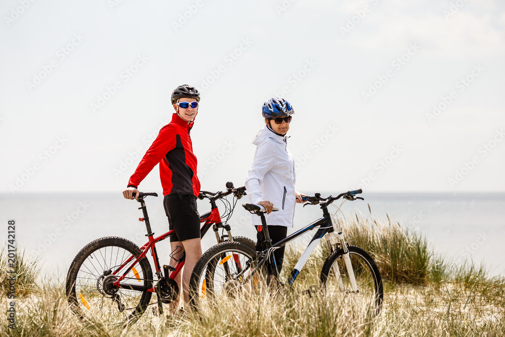 Fototapeta premium Healthy lifestyle - people riding bicycles