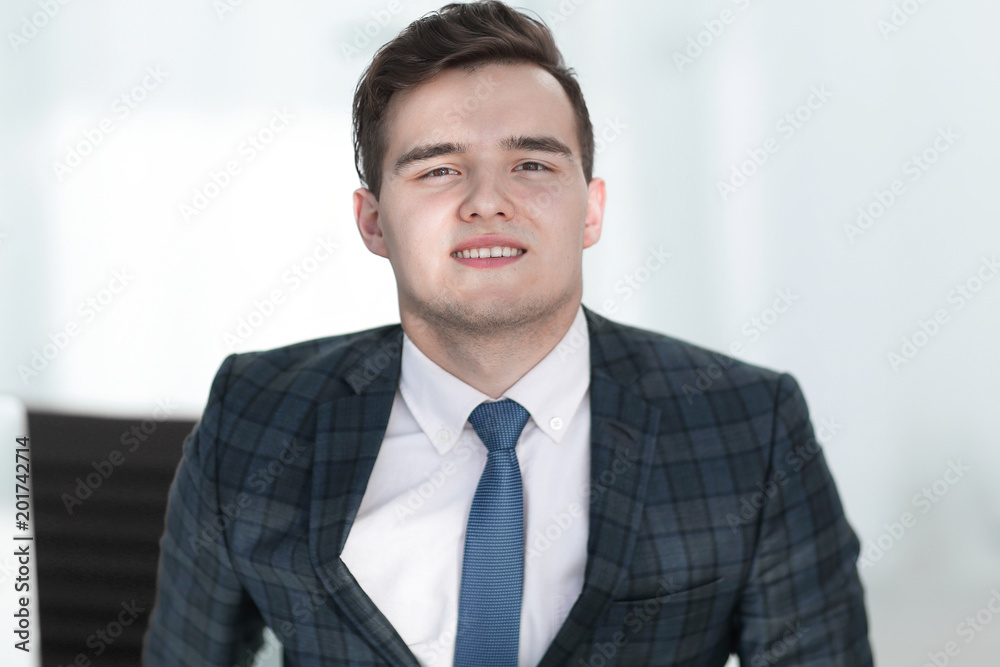 portrait of a young employee in the office portrait of a young employee in the office