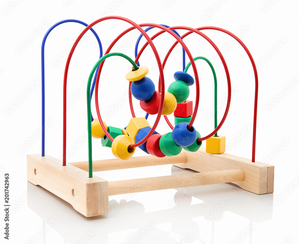 Childish toy perfect for children's brain in their early age. Toy for development child's mind. Brain teaser made of wood for little children isolated on the white background with shadow reflection. Childish toy perfect for children's brain in their early age. Toy for development child's mind. Brain teaser made of wood for little children isolated on the white background with shadow reflection.