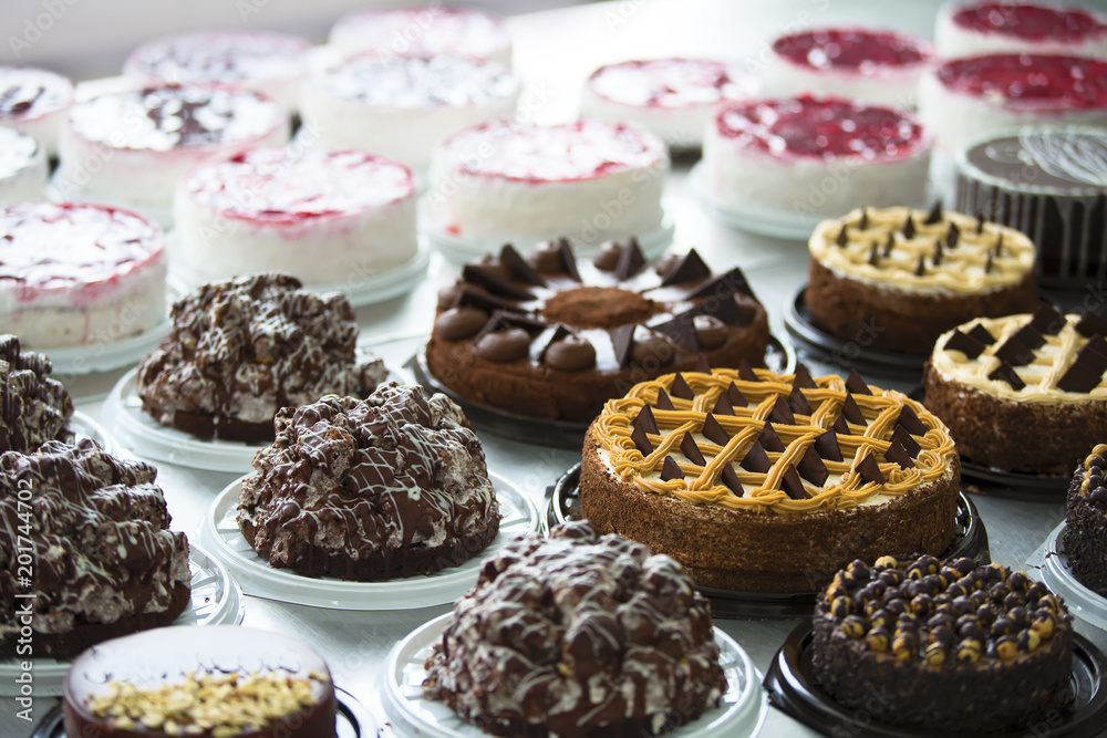 Many cakes on the table. Industrial Cake Line Many cakes on the table. Industrial Cake Line