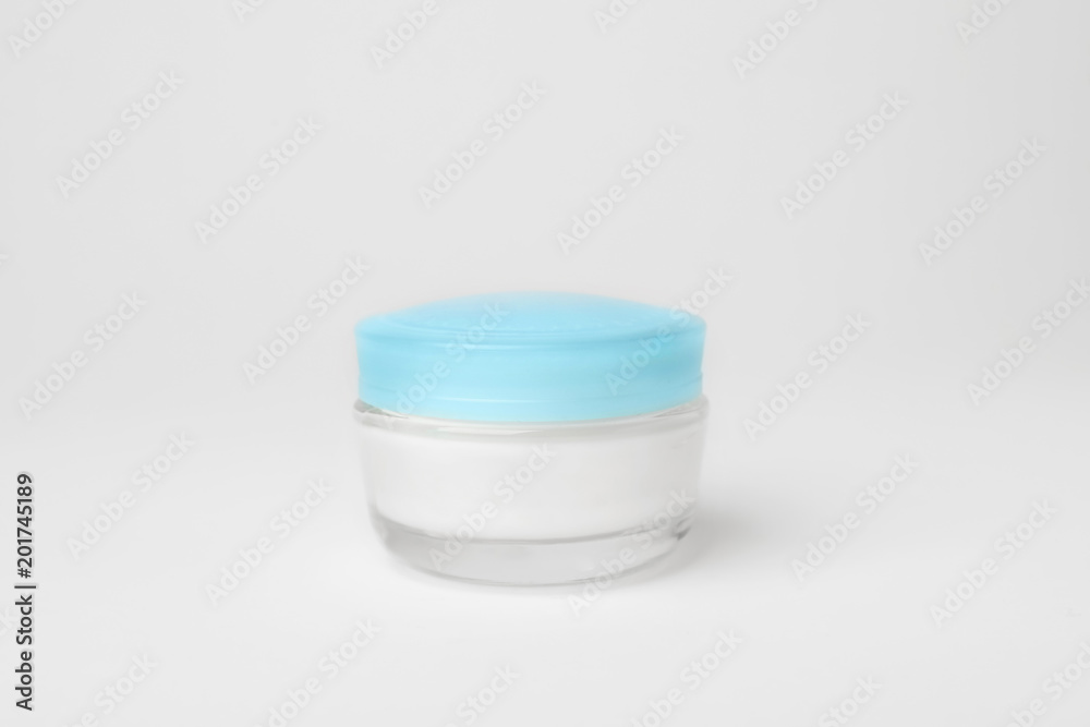 Jar of cosmetic product on light background Jar of cosmetic product on light background
