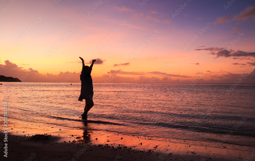 Woman's silhouette in the beautiful sunset