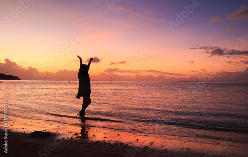 Woman s silhouette in the beautiful sunset