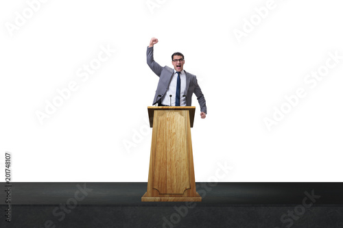 Φωτογραφία Man businessman making speech at rostrum in business concept