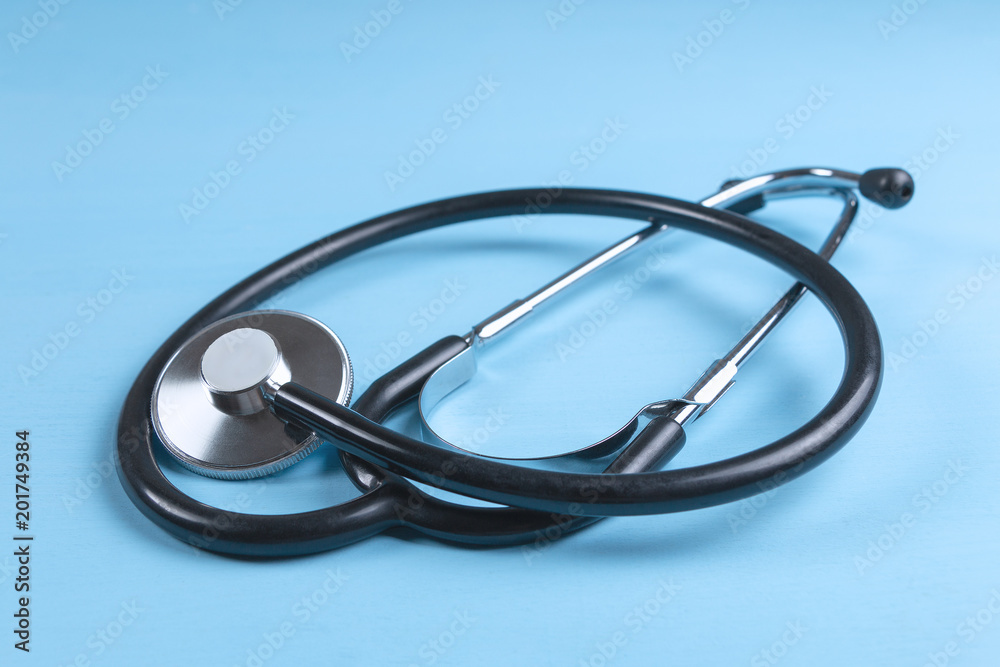 Stethoscope on blue wooden background Stethoscope on blue wooden background