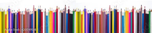 Colored pencils on table.