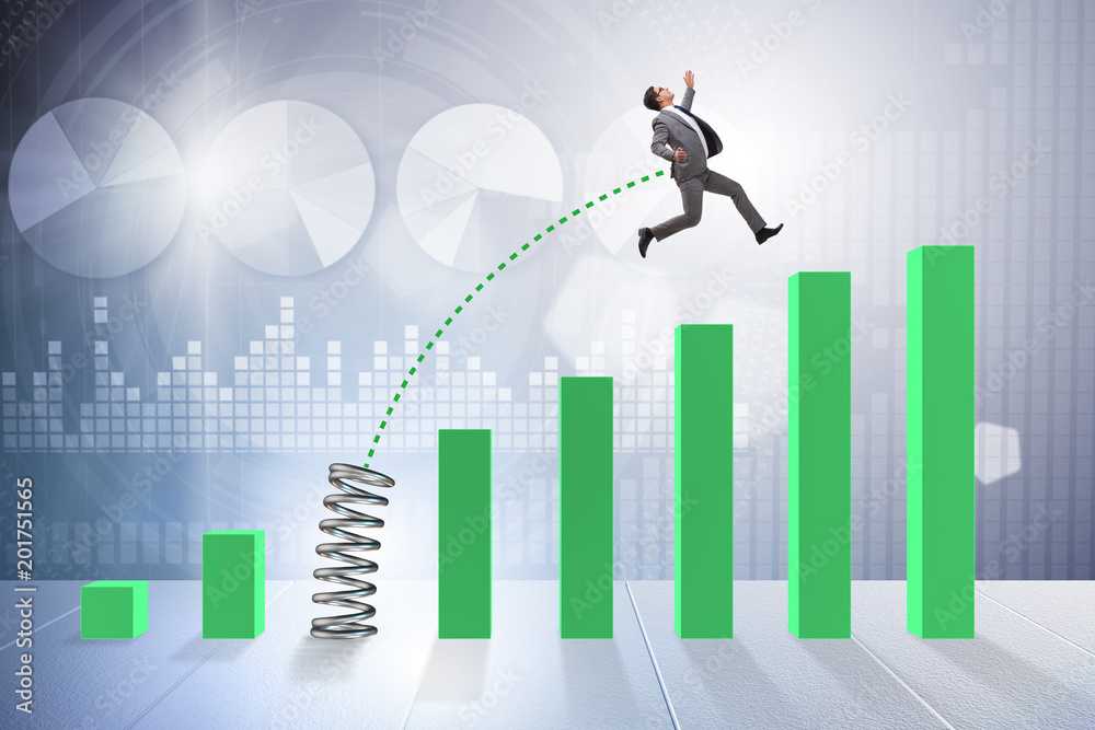 Business people jumping over bar charts Business people jumping over bar charts