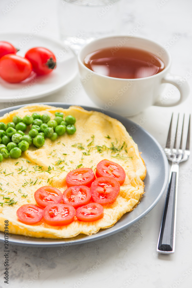 Omelette with green peas and cherry tomatoes. Protein breakfast Omelette with green peas and cherry tomatoes. Protein breakfast