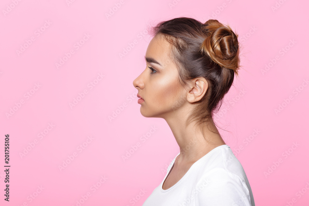 Fototapeta young woman on pink background Attractive beautiful woman showing air kiss