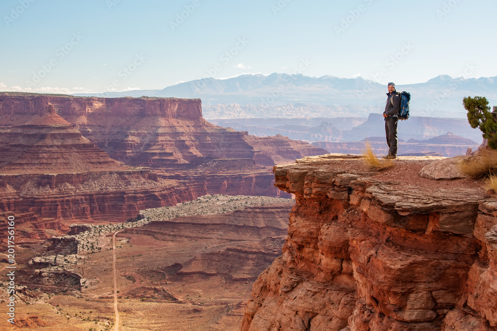 Hiker in Canyonlands National park in Utah, USA Hiker in Canyonlands National park in Utah, USA