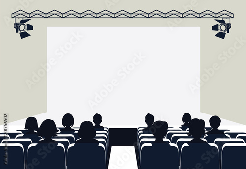 People in the cinema on the background of the screen.