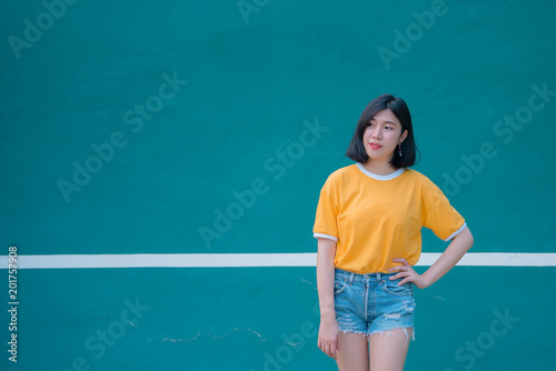 Portrait of beautiful asian chic girl pose for take a picture,Lifestyle of teen thailand people,Modern woman happy concept,Tennis couse, pastel tone © reewungjunerr