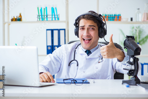 Male doctor listening to patient during telemedicine session
