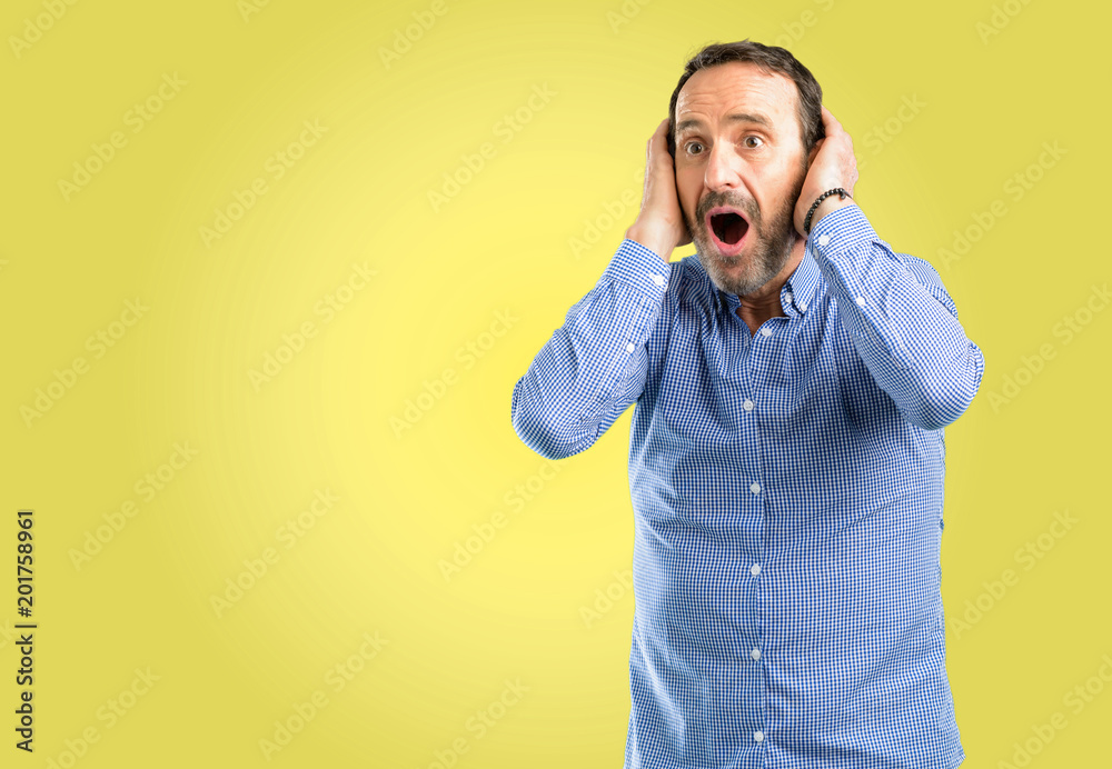 Handsome middle age man happy and surprised cheering expressing wow gesture Handsome middle age man happy and surprised cheering expressing wow gesture