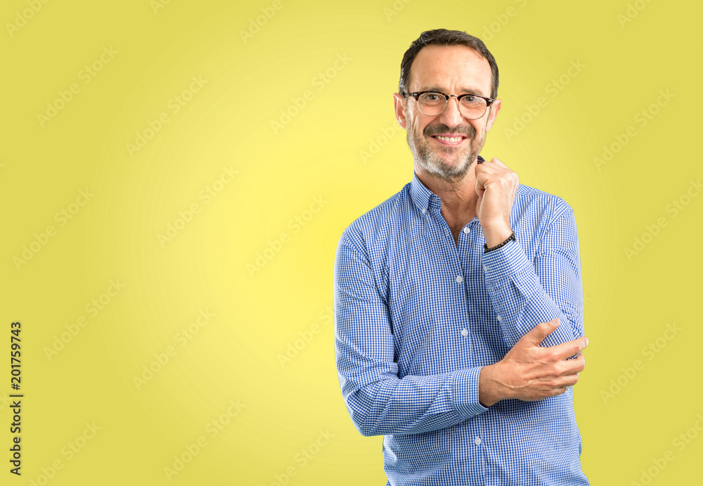 Handsome middle age man confident and happy with a big natural smile laughing Handsome middle age man confident and happy with a big natural smile laughing