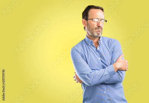 Handsome middle age man nervous and scared biting lips looking camera with impatient expression, pensive © Krakenimages.com