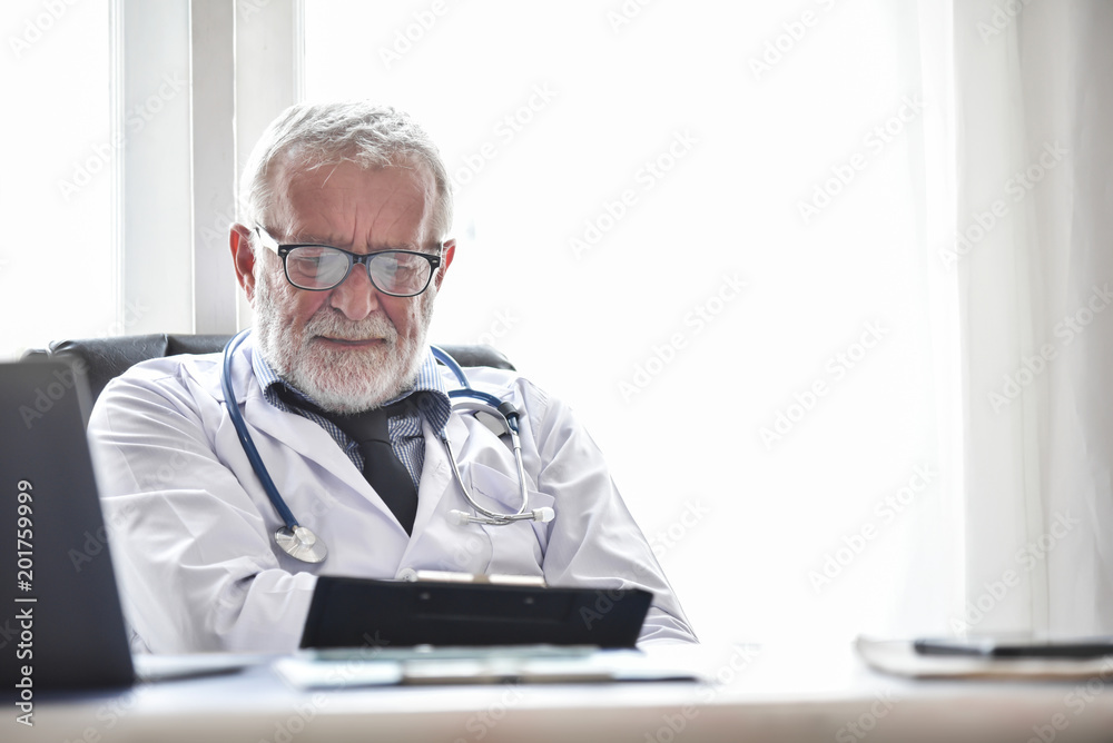Senior male Doctor is thinking. Senior male Doctor is thinking.