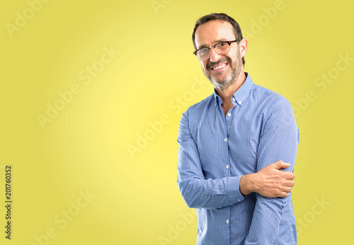 Handsome middle age man confident and happy with a big natural smile laughing, natural expression © Krakenimages.com