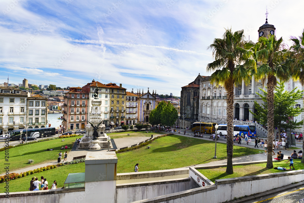 Elevated view of the garden of Infant Dom Enrique with his statue and the palace facade of the neoclassical style pouch, in the center of the city and cobblestone floor