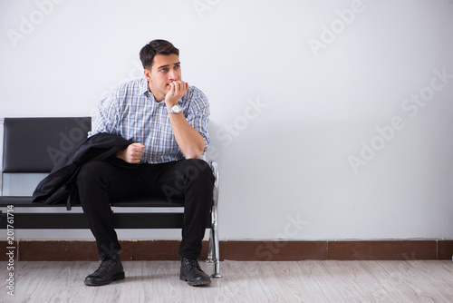 Slika na platnu Man nervously impatiently waiting in the lobby