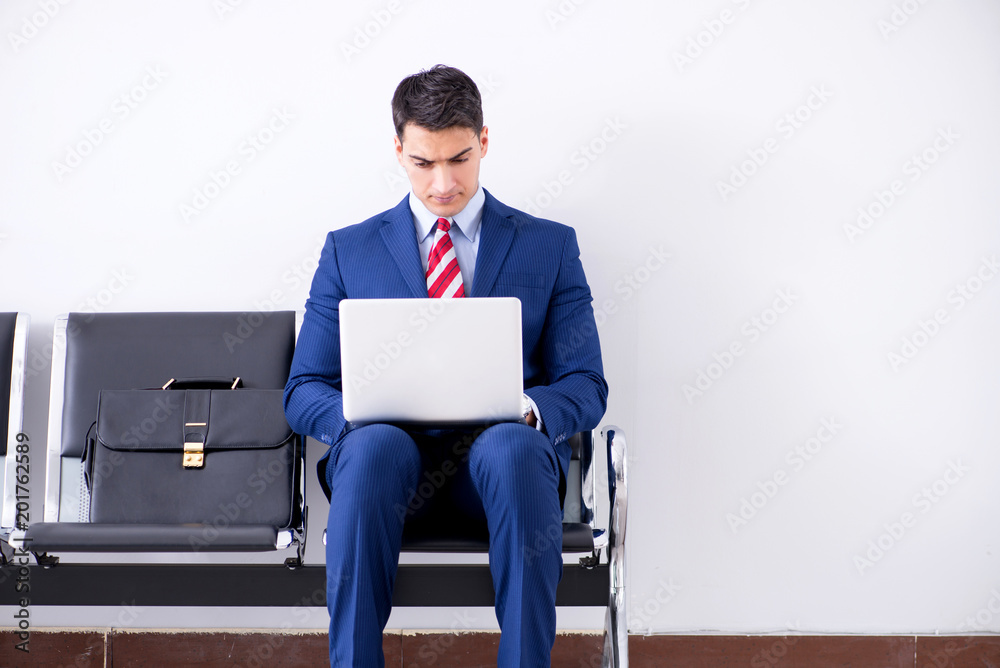 Man wairing to boarding in airport lounge room Man wairing to boarding in airport lounge room