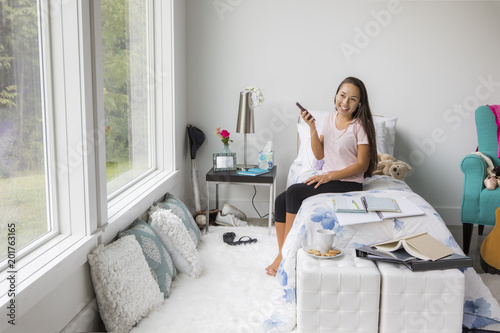 Teenage girl  in her bedroom