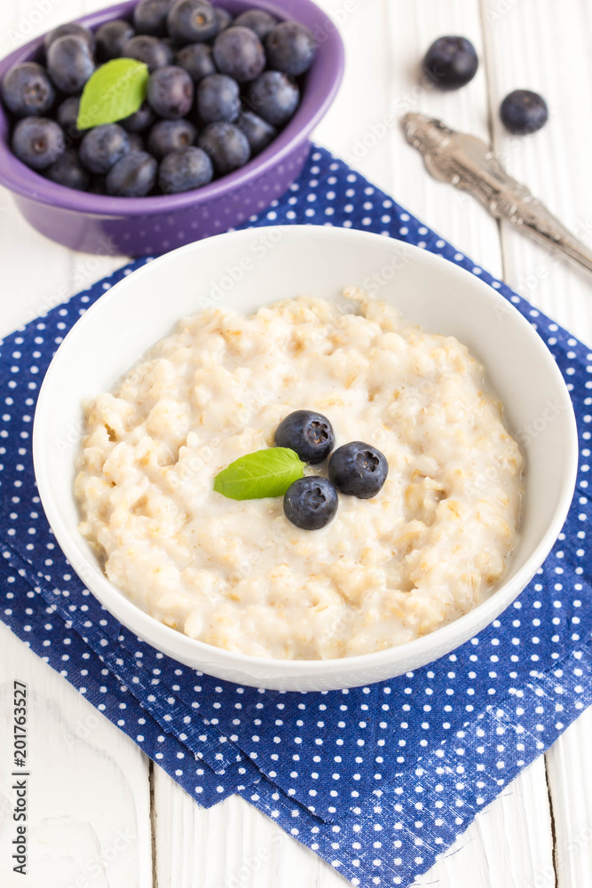 Oatmeal porridge with blueberries, tasty and healthy breakfast Oatmeal porridge with blueberries, tasty and healthy breakfast