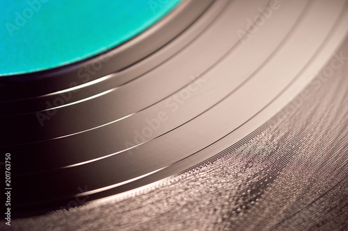 The texture of a black vinyl record player. Black dj's vinyl record for a music turntable on a white background close-up                                                 